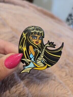 Monster High's Cleo De Nile Enamel Pin in Black, Yellow & Light Blue